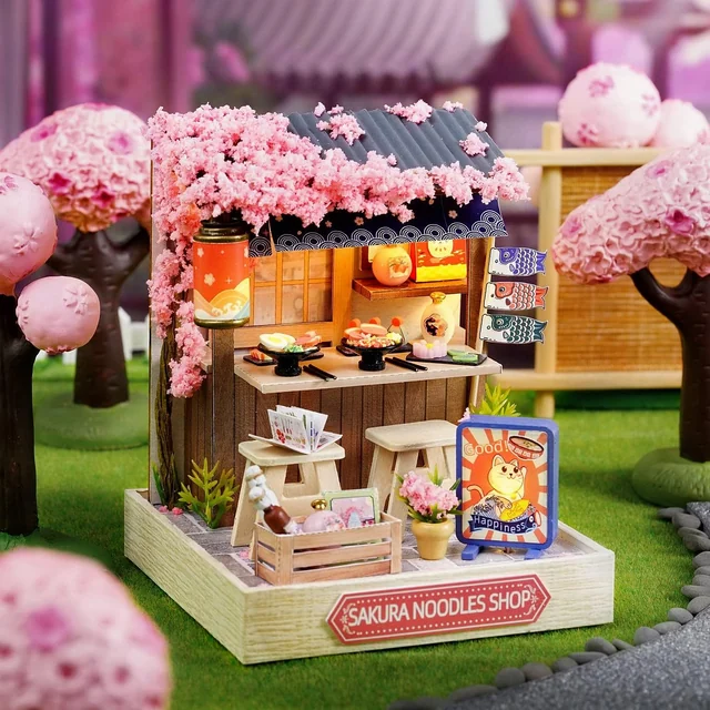 CUTEROOM Noodles Shop lit beneath its blossom-covered roof